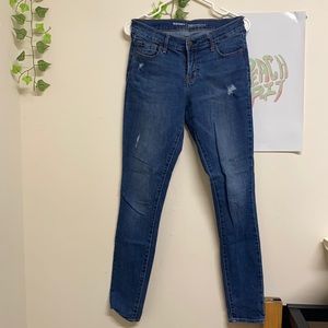 Women’s blue slightly ripped jeans.